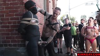 A crowd gathers to watch the brutal flogging