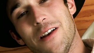 Hottie Cody lights his red cig while stroking his pinkish cock