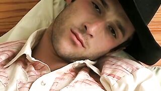 Hottie Cody lights his red cig while stroking his pinkish cock