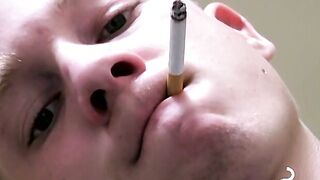 Twink savors the pleasure of smoking and stroking cock