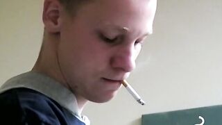 Twink savors the pleasure of smoking and stroking cock