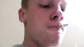 Twink savors the pleasure of smoking and stroking cock