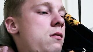 Twink savors the pleasure of smoking and stroking cock