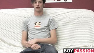 Adorable gay guy Danny jerks off his dick on couch solo