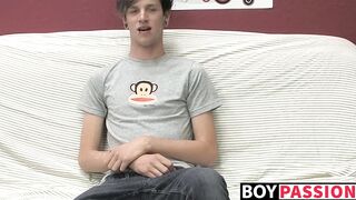 Adorable gay guy Danny jerks off his dick on couch solo