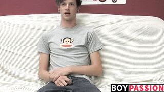 Adorable gay guy Danny jerks off his dick on couch solo