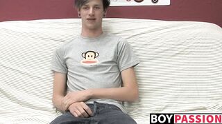 Adorable gay guy Danny jerks off his dick on couch solo