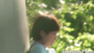Japanese cutie rubbing her pussy at a hidden outdoor place