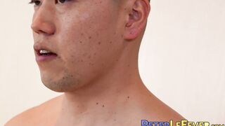 Buff and muscular Nozomu lubes his erect cock while doing an interview