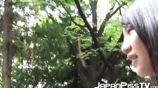 Naughty Asian babe close up pisses and outdoor pussy plays