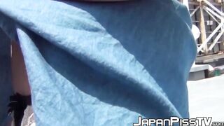 Beautiful Asian babe outdoor plays with pussy before pissing