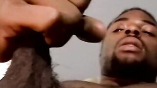 Amateur black guy jerks off solo with white dude kissing him