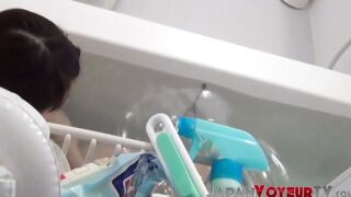 Asian babe filmed on hidden camera fingering her tight pussy