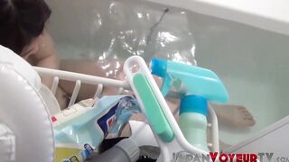 Asian babe filmed on hidden camera fingering her tight pussy