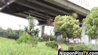 NipponPissTV.com - Debauched Asian schoolgirl pissing hard in public view on streets