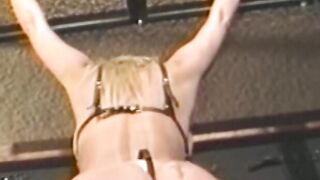 Busty blonde sub tied up for spanking in BDSM dungeon