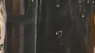 Busty blonde sub tied up for spanking in BDSM dungeon