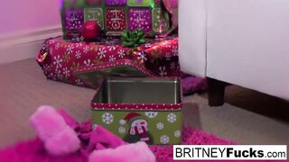 Britney finds a Christmas gift under the tree perfectly