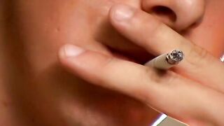 This hot smooth country jock chainsmokes while stroking and using a buttplug
