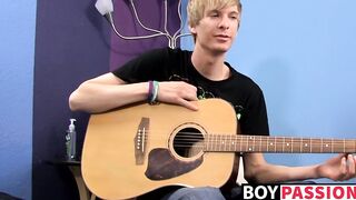 Young man plays guitar before dick stroking and cumming