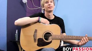 Young man plays guitar before dick stroking and cumming