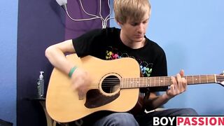Young man plays guitar before dick stroking and cumming