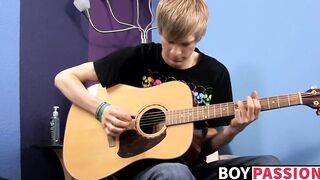 Young man plays guitar before dick stroking and cumming