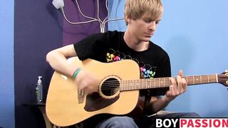 Young man plays guitar before dick stroking and cumming