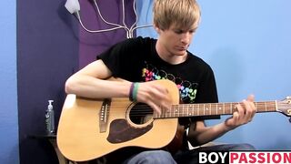 Young man plays guitar before dick stroking and cumming
