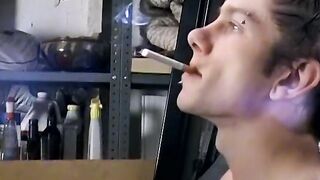 Attractive Ian Madrox is blowing smoke and starts stretching his cock in his smoky je