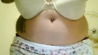 Big-Titted Brunette Plays with Her Nipples on Webcam