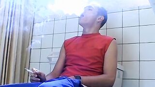 Attractive Yuri fires up his cig and sits on the toilet for his hot smokin and stroki