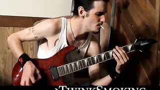 Straight rocker Axel plays his guitar and his throbbing cock with his pack of cigaret