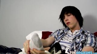 Stunning Tyler Bolt plays with his naked feet and sucking his toes