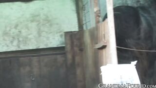 Kinky granny sucking cock outdoor and gets sprayed with cum