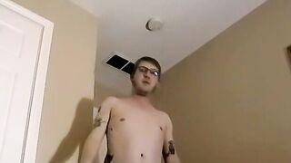 Tattooed amateur with glasses is stroking his massive dick