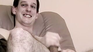 Homo is playing with his shaft and cums while watching porn
