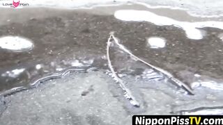 NipponPissTV.com - Real Japanese lady filmed while peeing in closeup outdoors