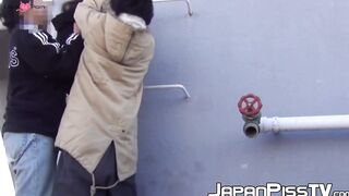 Young Asian cutie outdoors tied up and pees from the ladders