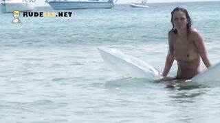 Young nudist with perky boobs is joined by a lovers on the beach