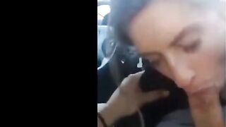 Pierced Brunette Blows in the Car
